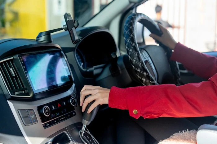 close-up-hands-of-woman-hold-joystick-or-steering-2023-12-06-22-19-51-utc