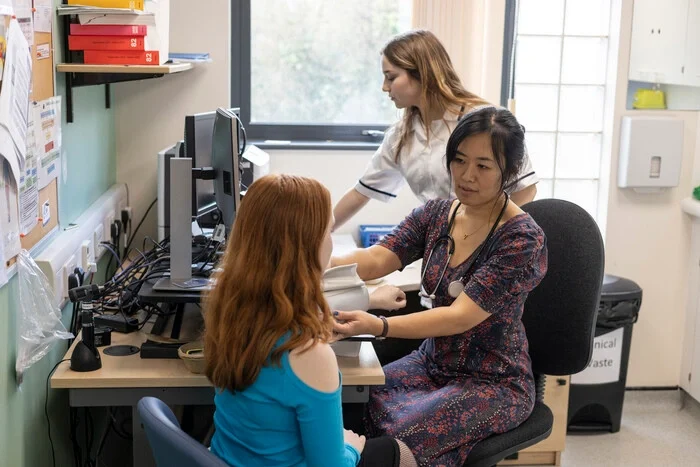 health-professional-taking-patient-s-blood-pressur-2024-08-19-22-51-57-utc